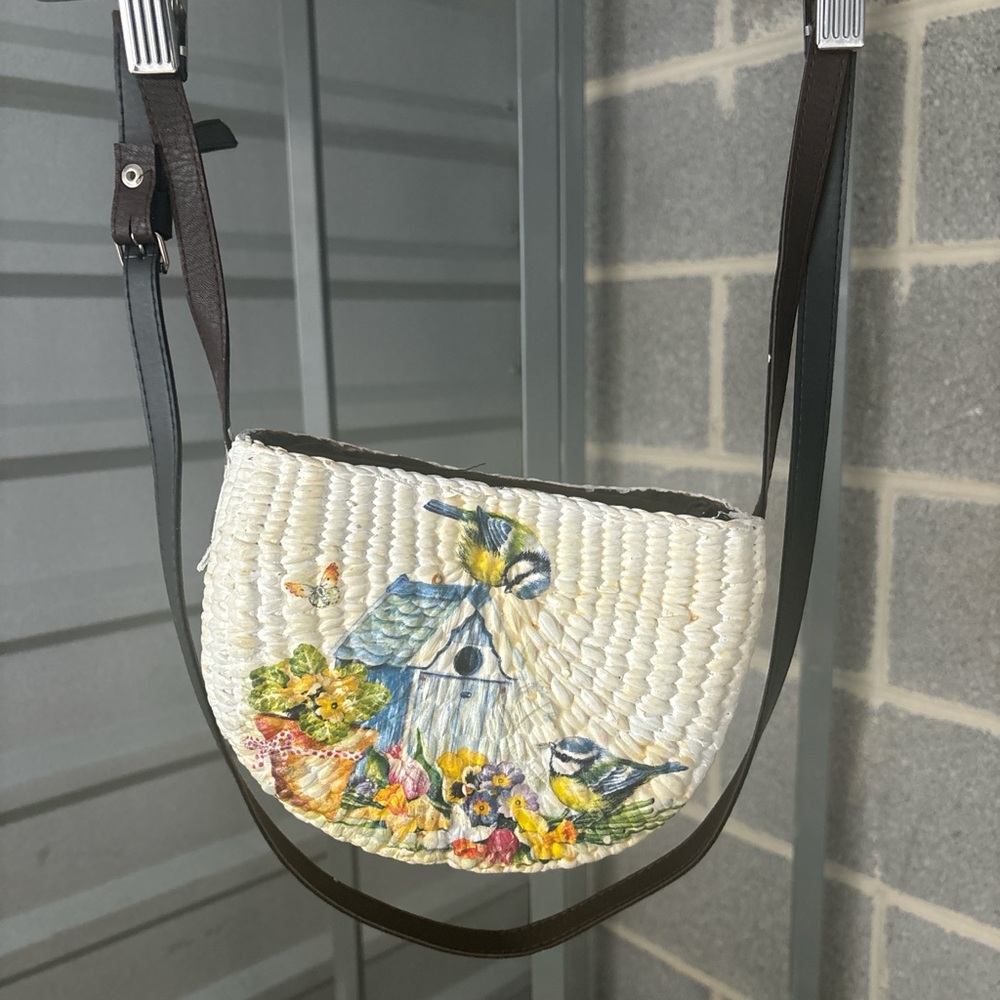 Shoulder bag with bird and flower detail